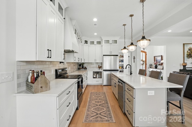 19 Berea Baptist Church Rd, Stanfield, NC 28163 - kitchen with stainless steel appliances, a kitchen bar, light wood-type flooring, light countertops, and backsplash