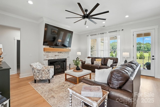19 Berea Baptist Church Rd, Stanfield, NC 28163 - living room featuring light wood-style floors, ceiling fan, ornamental molding, a fireplace, and recessed lighting
