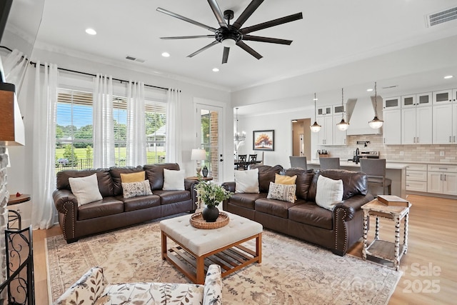 19 Berea Baptist Church Rd, Stanfield, NC 28163 - living room featuring ceiling fan, recessed lighting, light wood-style floors, and crown molding