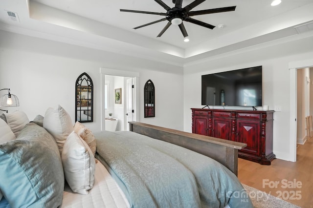 19 Berea Baptist Church Rd, Stanfield, NC 28163 - bedroom with a raised ceiling, recessed lighting, and light wood-style flooring