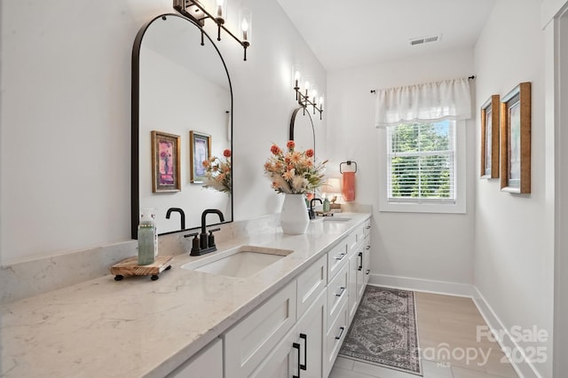 19 Berea Baptist Church Rd, Stanfield, NC 28163 - full bath featuring double vanity and wood finished floors
