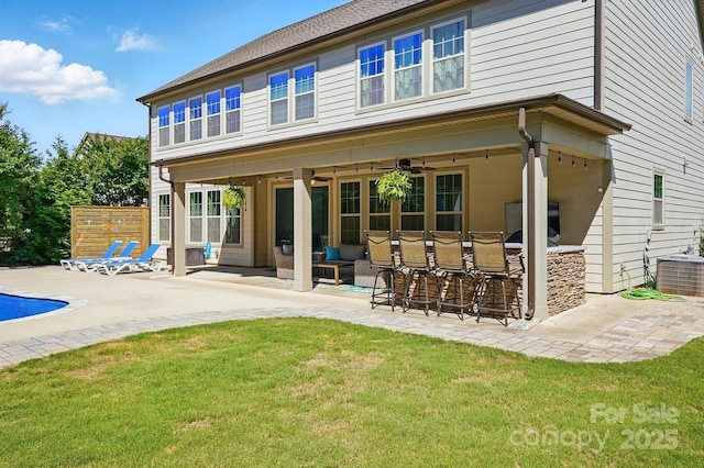 5105 Paisano Ln, Waxhaw, NC 28173 - back of house with a patio area, an outdoor bar, a yard, and ceiling fan