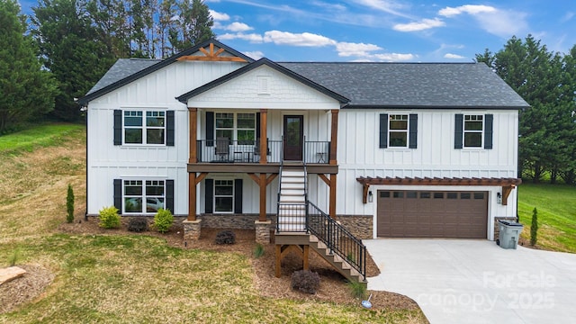 2205 Olde W Rd, Hudson, NC 28638 - modern farmhouse style home featuring stairs, board and batten siding, a garage, and a shingled roof