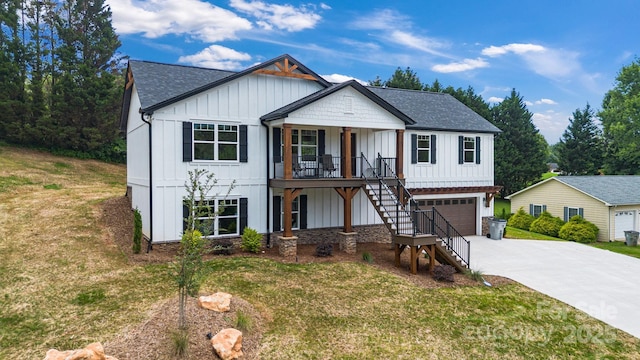 2205 Olde W Rd, Hudson, NC 28638 - modern inspired farmhouse with stairway, board and batten siding, covered porch, a shingled roof, and concrete driveway
