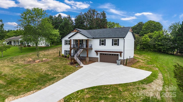 2205 Olde W Rd, Hudson, NC 28638 - modern farmhouse style home with stairway, an attached garage, driveway, a front lawn, and stone siding