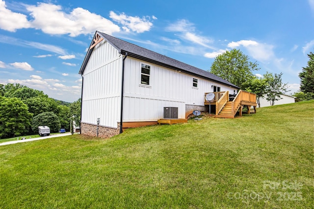 2205 Olde W Rd, Hudson, NC 28638 - back of house featuring board and batten siding, a wooden deck, stairs, and a lawn