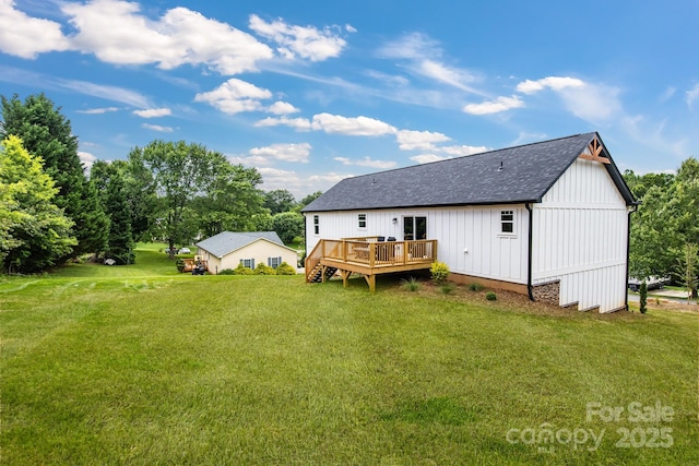 2205 Olde W Rd, Hudson, NC 28638 - back of property featuring a wooden deck, a lawn, roof with shingles, and board and batten siding