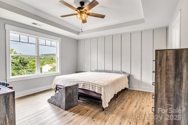 2205 Olde W Rd, Hudson, NC 28638 - bedroom featuring a tray ceiling, light wood-style floors, crown molding, and ceiling fan