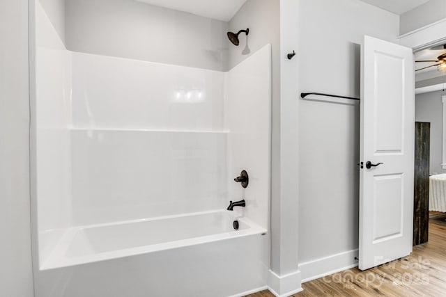 2205 Olde W Rd, Hudson, NC 28638 - bathroom featuring wood finished floors, shower / bath combination, and a ceiling fan