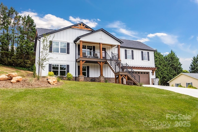 2205 Olde W Rd, Hudson, NC 28638 - view of front of home featuring stairway, board and batten siding, a front lawn, an attached garage, and driveway