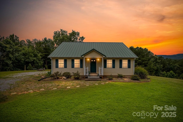 303 Ridgeview Dr, Mill Spring, NC 28756 - view of front of home with a front yard, a metal roof, and driveway
