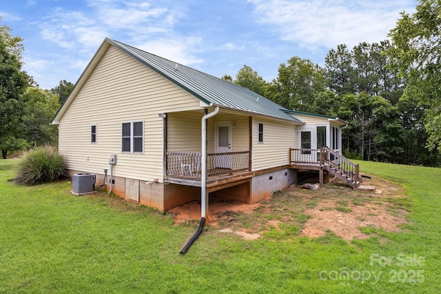 303 Ridgeview Dr, Mill Spring, NC 28756 - view of home's exterior featuring crawl space, a yard, a metal roof, and a deck