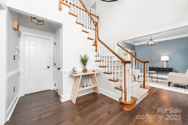 5408 Apple Glen Dr, Harrisburg, NC 28075 - stairway with a chandelier, wood finished floors, and crown molding