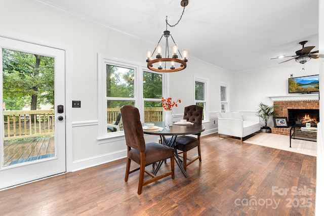 5408 Apple Glen Dr, Harrisburg, NC 28075 - dining room with plenty of natural light, a chandelier, crown molding, and dark wood-style flooring