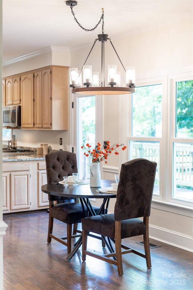 5408 Apple Glen Dr, Harrisburg, NC 28075 - dining space featuring ornamental molding, a chandelier, and dark wood finished floors