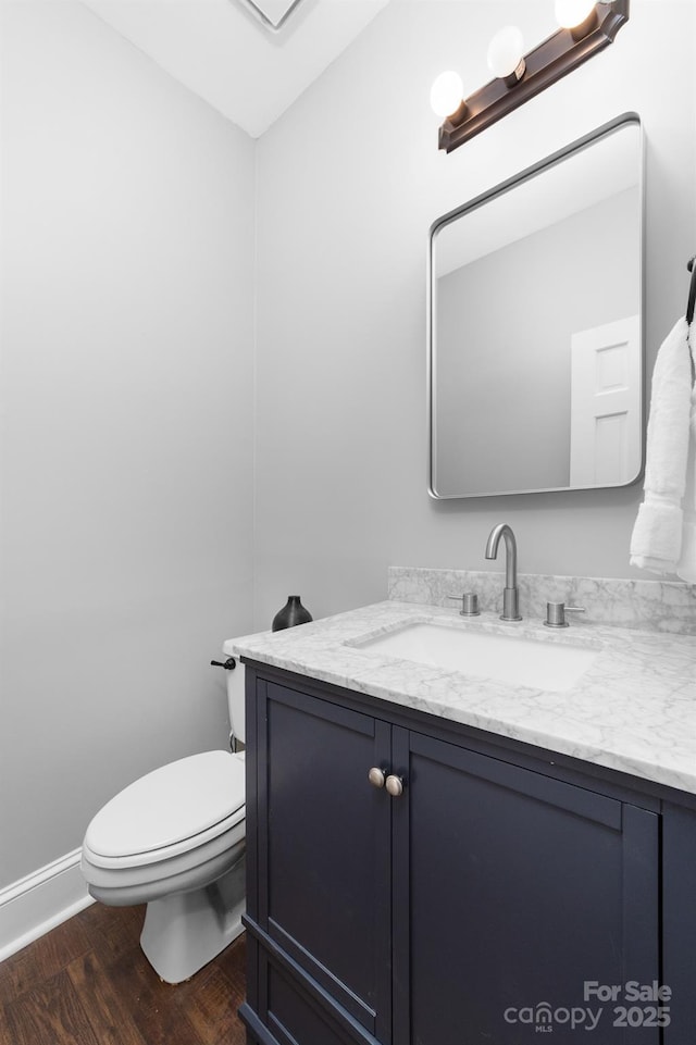 5408 Apple Glen Dr, Harrisburg, NC 28075 - half bath with vanity and wood finished floors