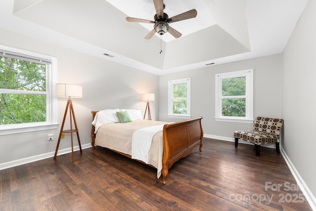 5408 Apple Glen Dr, Harrisburg, NC 28075 - bedroom featuring a tray ceiling, wood finished floors, and a ceiling fan