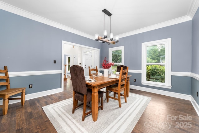 5408 Apple Glen Dr, Harrisburg, NC 28075 - dining area featuring wood finished floors, crown molding, and a chandelier