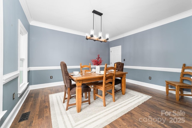 5408 Apple Glen Dr, Harrisburg, NC 28075 - dining area featuring a chandelier, wood finished floors, and ornamental molding
