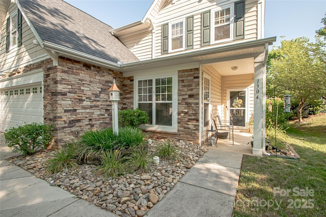 1304 Hammond Dr, Matthews, NC 28104 - property entrance with stone siding, a porch, and roof with shingles