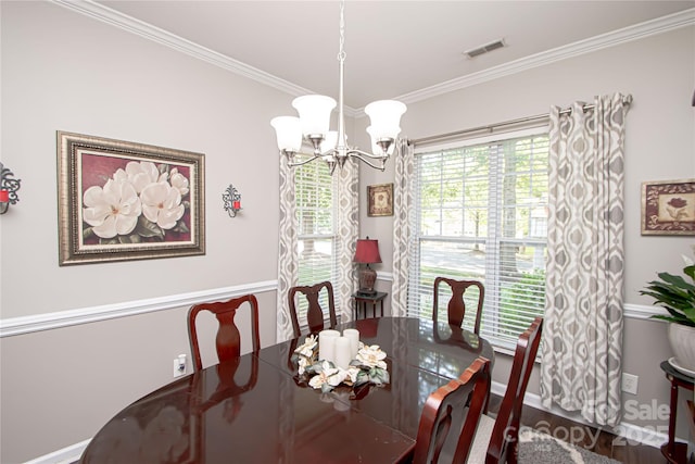 1304 Hammond Dr, Matthews, NC 28104 - dining room featuring a chandelier and crown molding