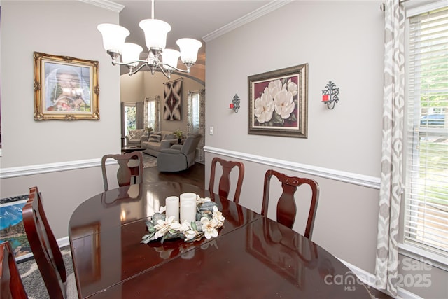 1304 Hammond Dr, Matthews, NC 28104 - dining space featuring plenty of natural light, a chandelier, and ornamental molding