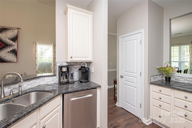 1304 Hammond Dr, Matthews, NC 28104 - kitchen featuring stainless steel dishwasher, dark wood-style floors, tasteful backsplash, and dark stone counters