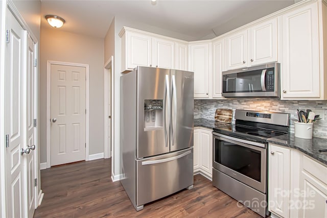 1304 Hammond Dr, Matthews, NC 28104 - kitchen featuring stainless steel appliances, tasteful backsplash, dark wood-type flooring, and white cabinets