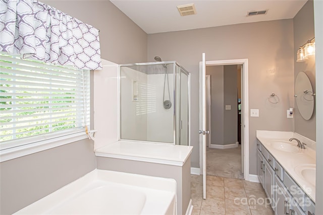 1304 Hammond Dr, Matthews, NC 28104 - full bath featuring a stall shower, a garden tub, double vanity, and tile patterned floors