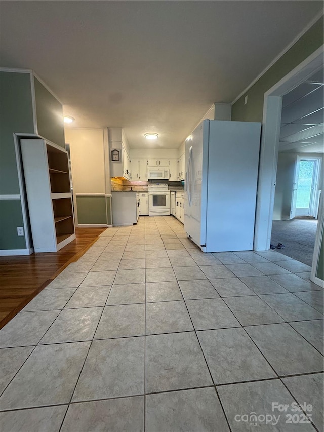 5367 Meadowlane Dr, Granite Falls, NC 28630 - kitchen featuring white appliances, light tile patterned flooring, white cabinetry, and crown molding