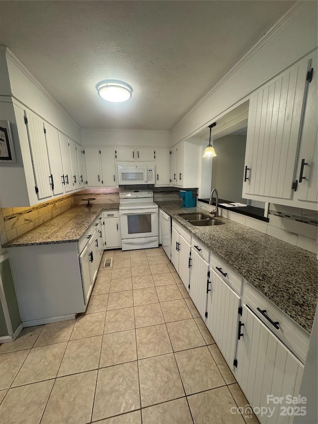5367 Meadowlane Dr, Granite Falls, NC 28630 - kitchen with white appliances, dark stone countertops, a textured ceiling, light tile patterned flooring, and white cabinets