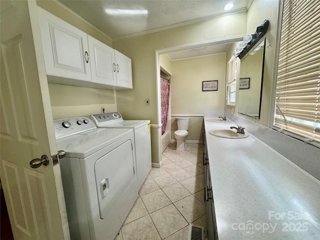 5367 Meadowlane Dr, Granite Falls, NC 28630 - washroom featuring washing machine and dryer, light tile patterned floors, and crown molding
