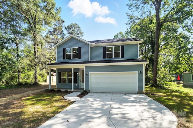 411 Patience Dr, Concord, NC 28025 - traditional home featuring a porch, concrete driveway, an attached garage, and a front lawn