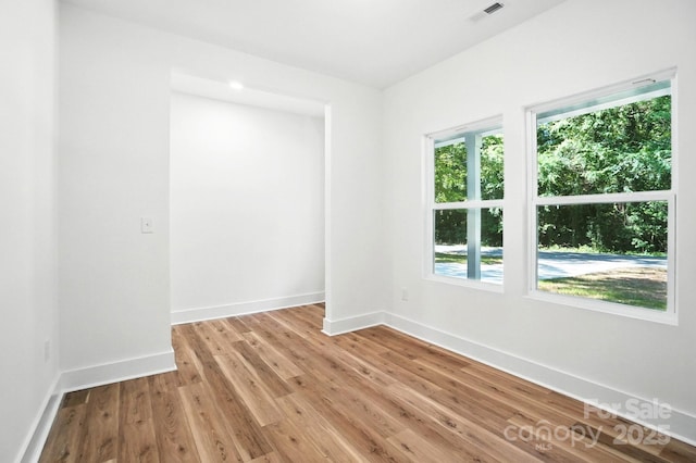 411 Patience Dr, Concord, NC 28025 - empty room featuring baseboards and light wood-type flooring