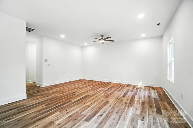 411 Patience Dr, Concord, NC 28025 - spare room featuring wood finished floors, a ceiling fan, and recessed lighting