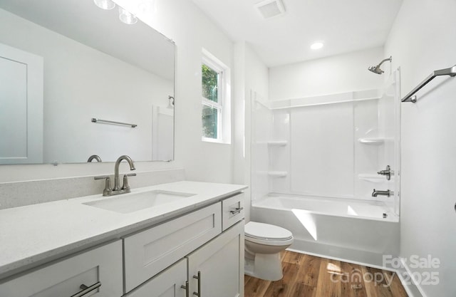 411 Patience Dr, Concord, NC 28025 - bathroom with vanity, wood finished floors, and tub / shower combination