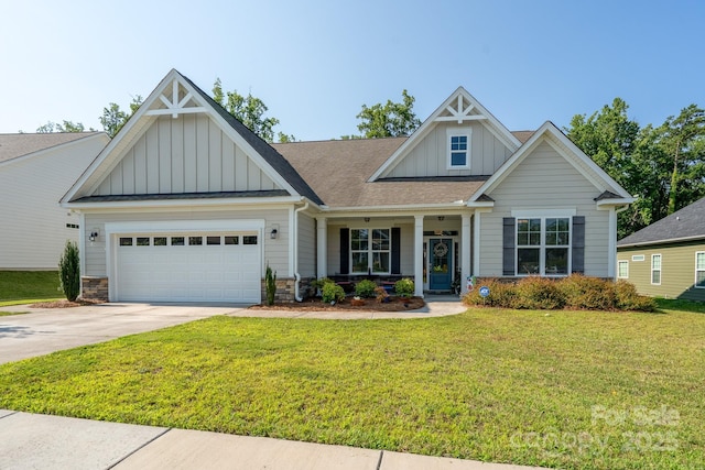 2407 Baxter Pl SE, Concord, NC 28025 - craftsman-style home featuring board and batten siding, a front yard, an attached garage, driveway, and stone siding