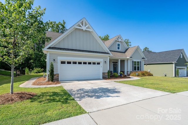 2407 Baxter Pl SE, Concord, NC 28025 - view of front facade with board and batten siding, a front lawn, concrete driveway, and stone siding