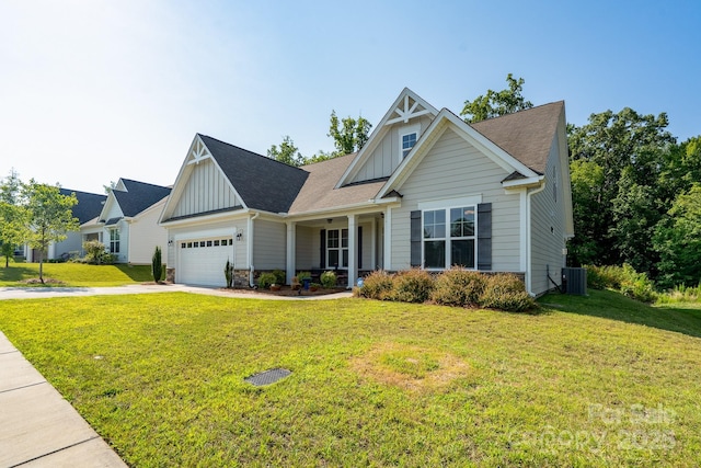 2407 Baxter Pl SE, Concord, NC 28025 - view of front facade with board and batten siding, a front yard, an attached garage, concrete driveway, and roof with shingles
