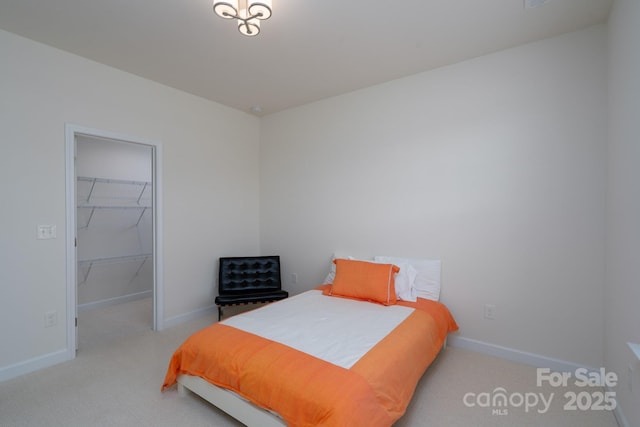 2407 Baxter Pl SE, Concord, NC 28025 - bedroom with carpet floors, a spacious closet, and a closet
