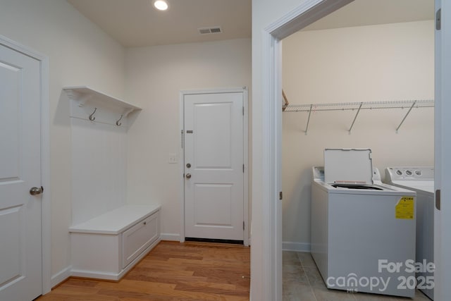 2407 Baxter Pl SE, Concord, NC 28025 - laundry area featuring washer and clothes dryer, light wood-type flooring, and recessed lighting