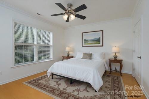 18730 Nautical Dr Unit 102, Cornelius, NC 28031 - bedroom featuring wood finished floors, crown molding, and ceiling fan