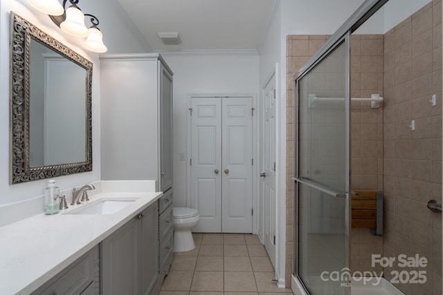 18730 Nautical Dr Unit 102, Cornelius, NC 28031 - full bath featuring vanity, a stall shower, ornamental molding, and tile patterned flooring