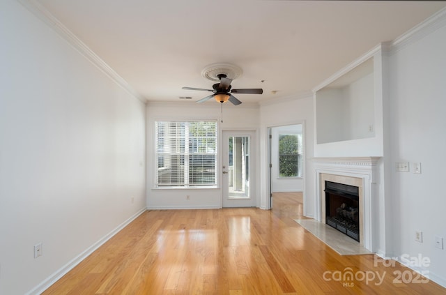 18730 Nautical Dr Unit 102, Cornelius, NC 28031 - unfurnished living room featuring ceiling fan, a fireplace, light wood-type flooring, and ornamental molding