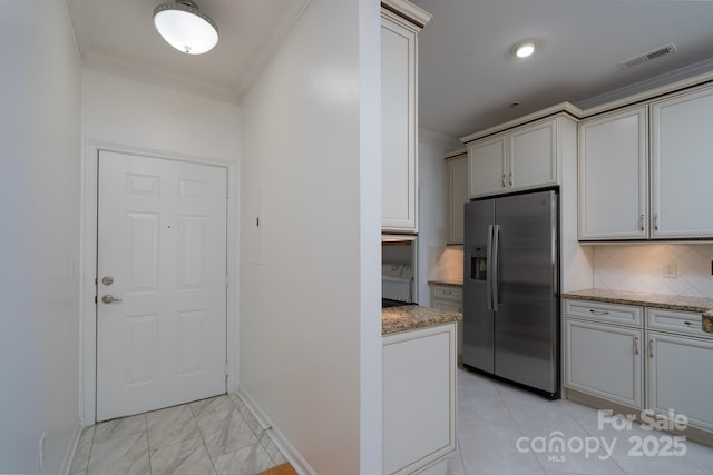 18730 Nautical Dr Unit 102, Cornelius, NC 28031 - kitchen featuring stainless steel refrigerator with ice dispenser, crown molding, backsplash, and light stone counters