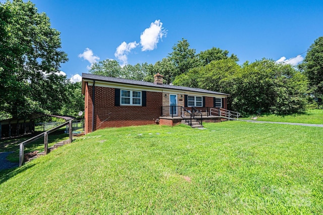 559 15th Ave SE, Hickory, NC 28602 - ranch-style house with brick siding, a chimney, and a front yard