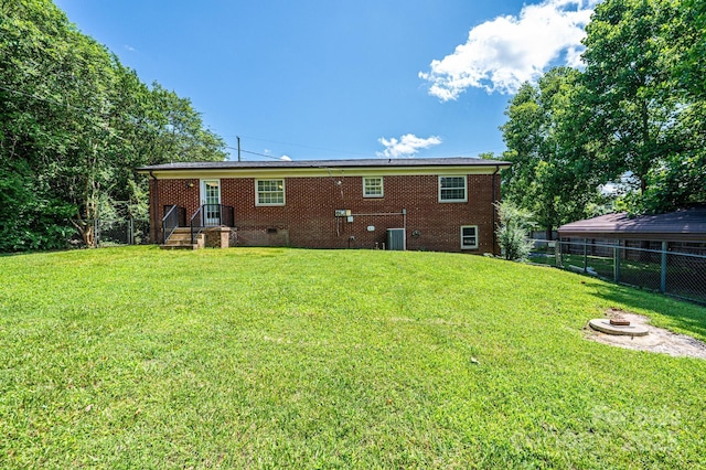 559 15th Ave SE, Hickory, NC 28602 - back of property with an outdoor fire pit and brick siding