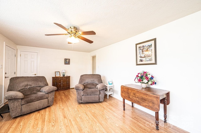 559 15th Ave SE, Hickory, NC 28602 - living room with light wood-style floors, ceiling fan, and a textured ceiling