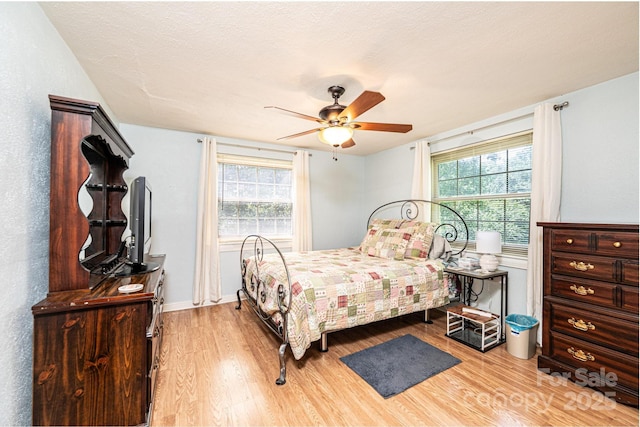 559 15th Ave SE, Hickory, NC 28602 - bedroom with light wood-style floors and ceiling fan
