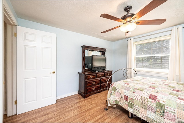 559 15th Ave SE, Hickory, NC 28602 - bedroom with light wood-type flooring and a ceiling fan